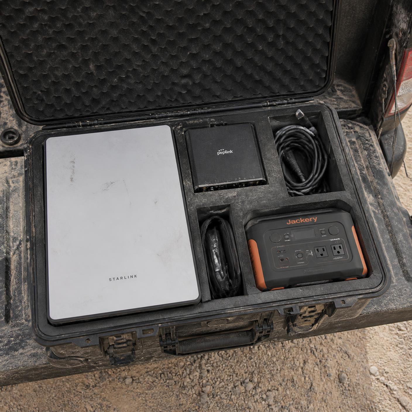 Ruggedized hard case kit packed with satellite terminal, router and cabling